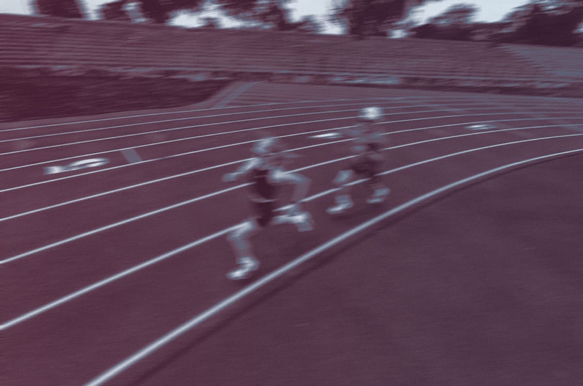 Runners rounding the track